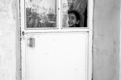 1464-G-A-girl-back-in-a-small-room-in-the-village