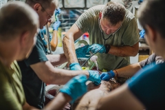 463-G-Ukrainian-Doctors-Provide-Aid-to-a-Wounded-Soldier