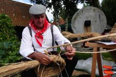 0022-G-Skep-weaver-at-work-in-the-Open-Air-Museum-Bachten-de-Kupe-in-Izenberge-Belgium